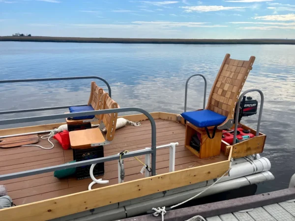 A boat with chairs and a table on it