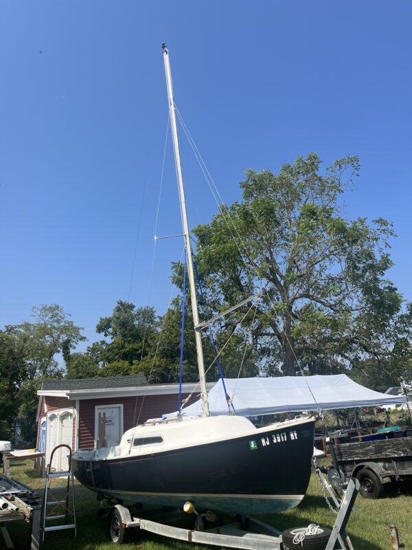 A small boat is parked in the yard.