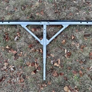Aluminum leaf rake on ground.
